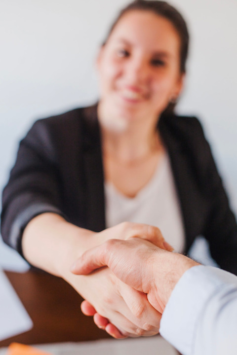 Office worker shaking hands
