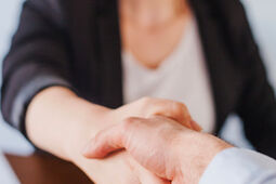 Office worker shaking hands