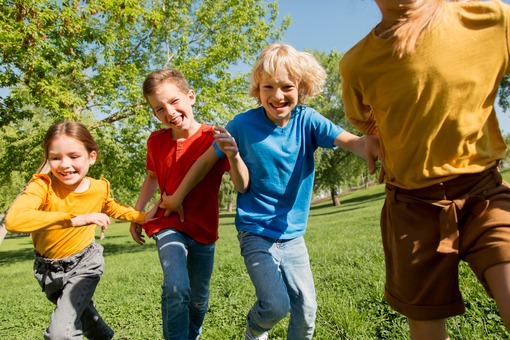 Close up kids running together
